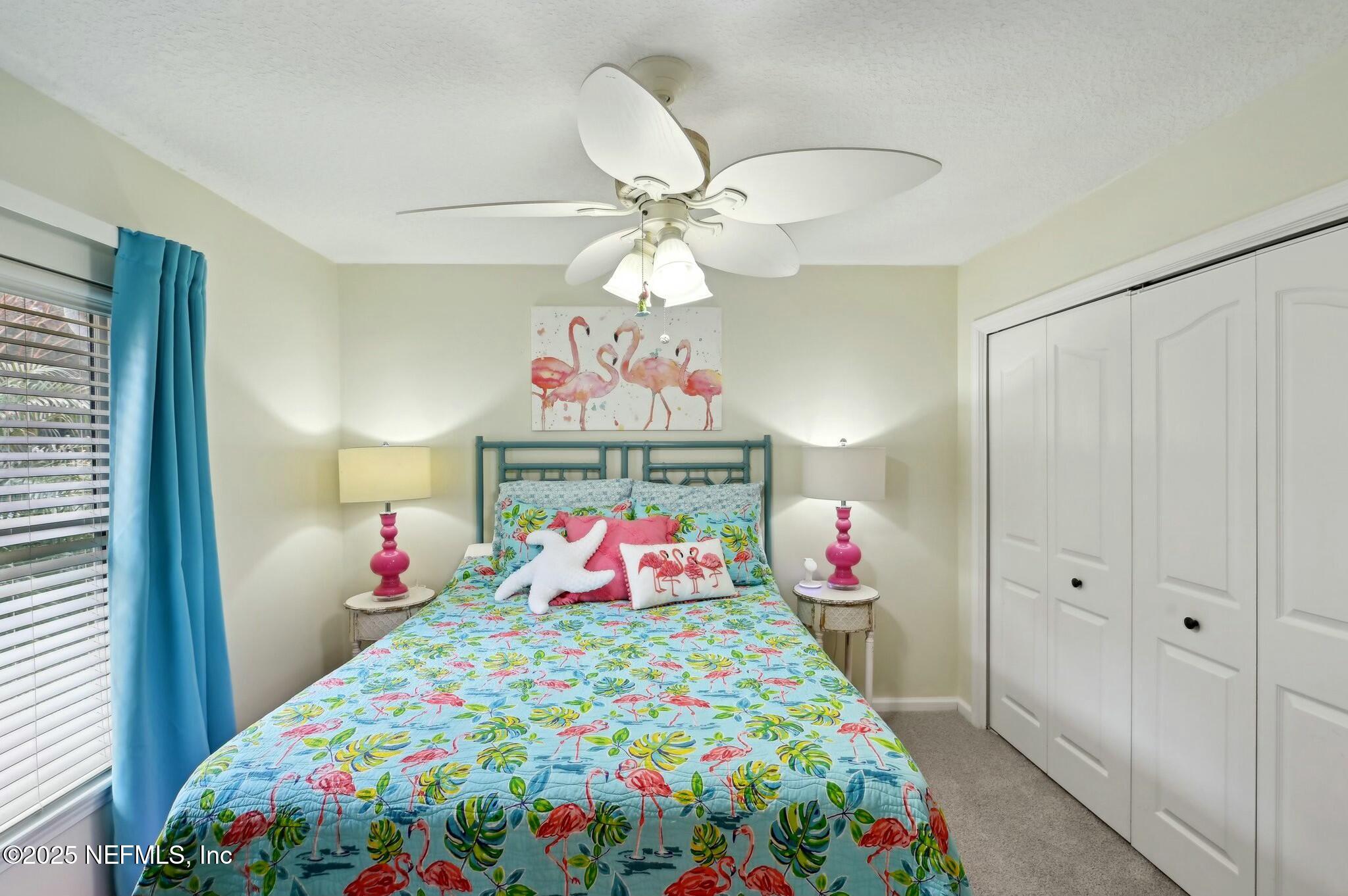 1732 Margarets Walk Road Fleming Island, FL 32003 - Photo 35 of 55 a bedroom that has a bed and a chandelier