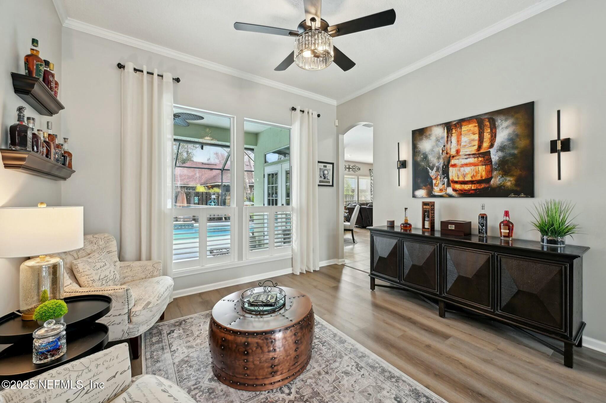 1732 Margarets Walk Road Fleming Island, FL 32003 - Photo 4 of 55 a living room with furniture and a flat screen tv
