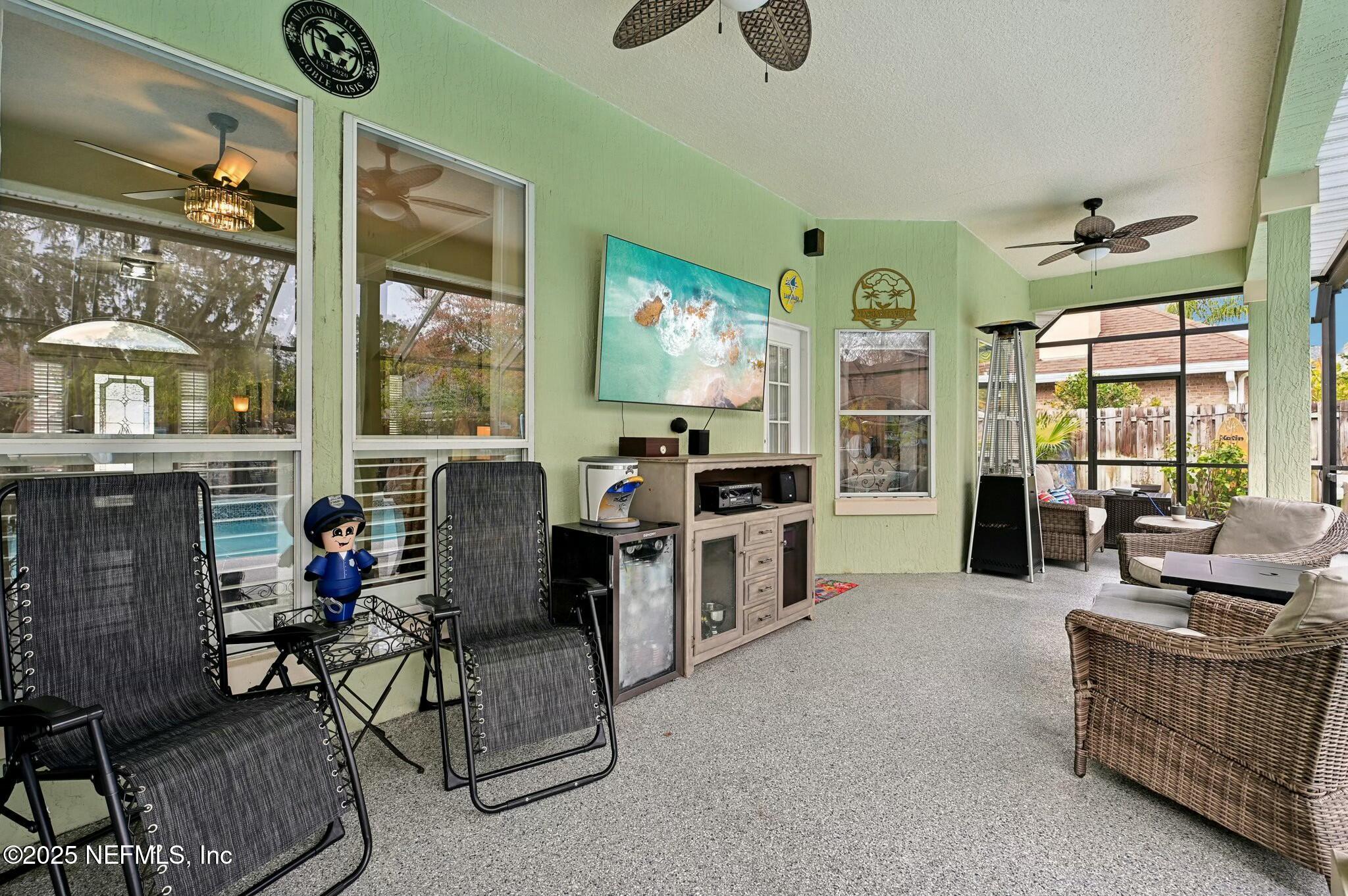 1732 Margarets Walk Road Fleming Island, FL 32003 - Photo 43 of 55 a living room with furniture and large windows