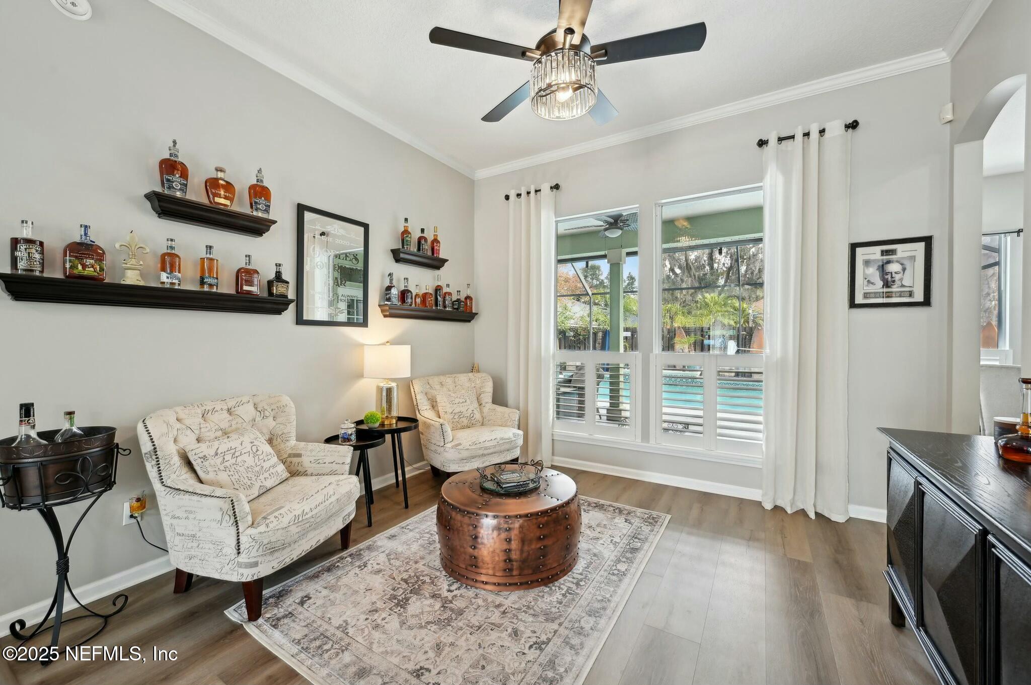 1732 Margarets Walk Road Fleming Island, FL 32003 - Photo 5 of 55 a living room with furniture and a large window