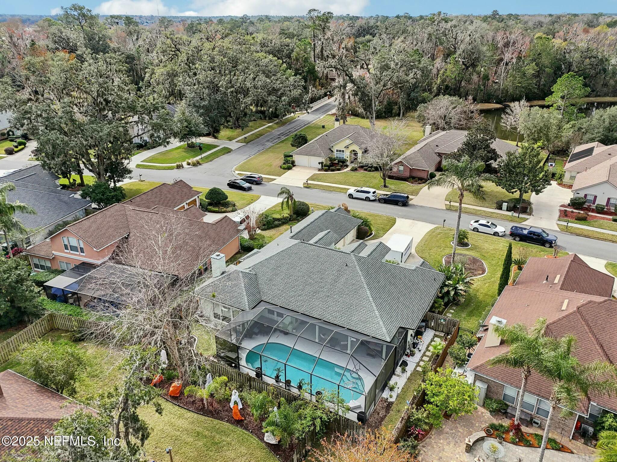 1732 Margarets Walk Road Fleming Island, FL 32003 - Photo 53 of 55 an aerial view of a house with a swimming pool outdoor seating and yard