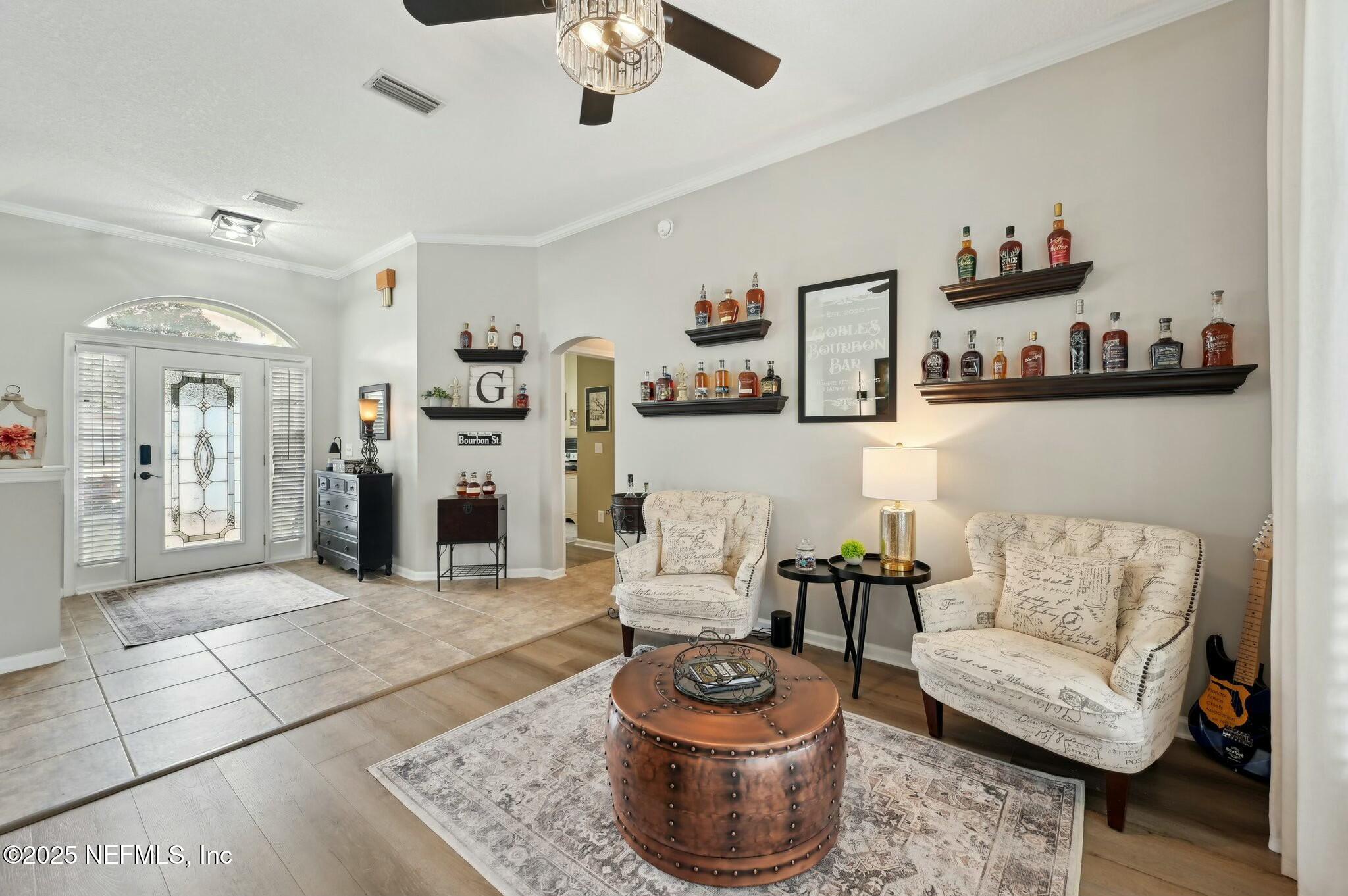 1732 Margarets Walk Road Fleming Island, FL 32003 - Photo 6 of 55 a living room with furniture and a wooden floor