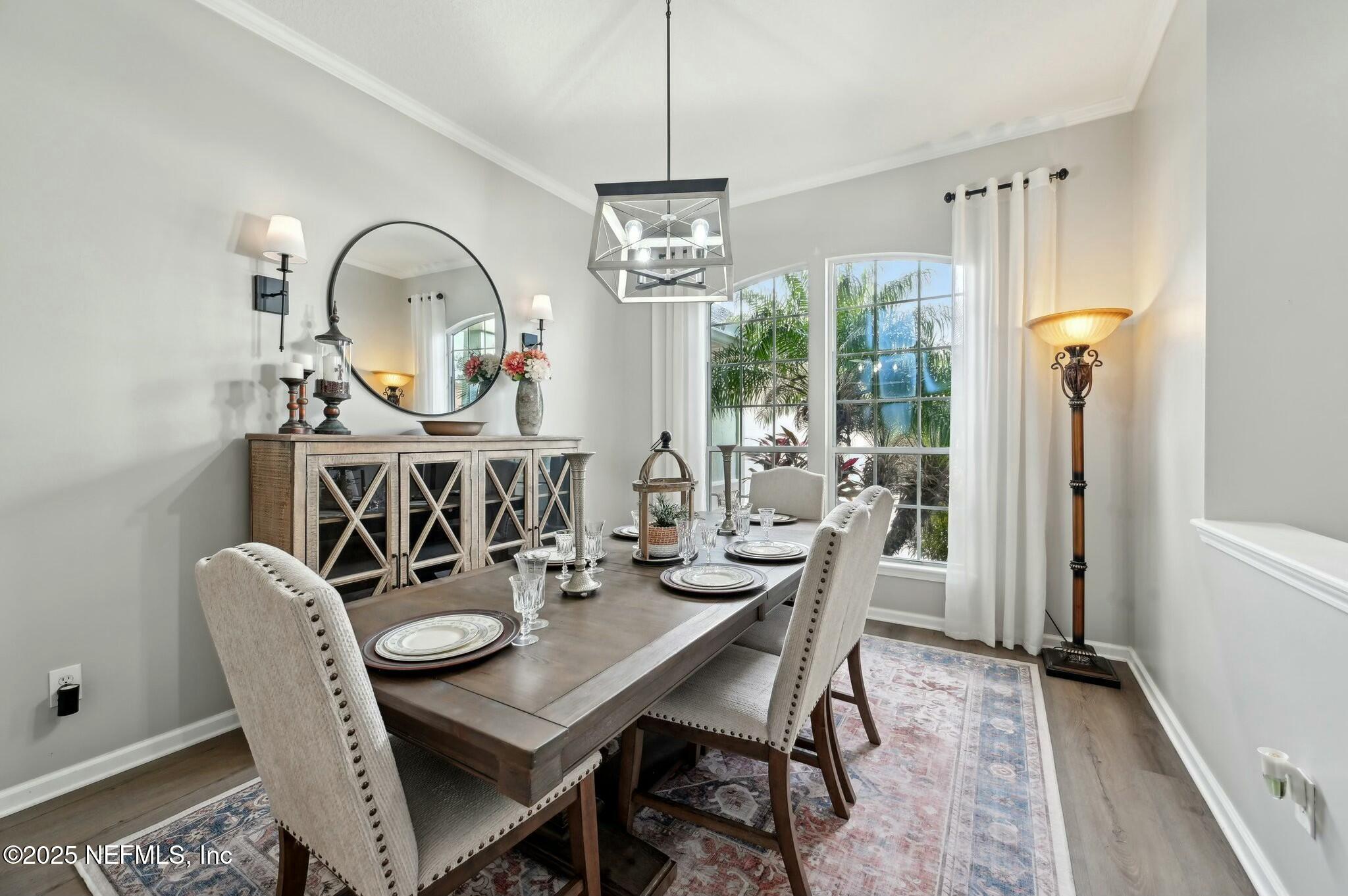 1732 Margarets Walk Road Fleming Island, FL 32003 - Photo 7 of 55 a view of a dining room with furniture window and wooden floor