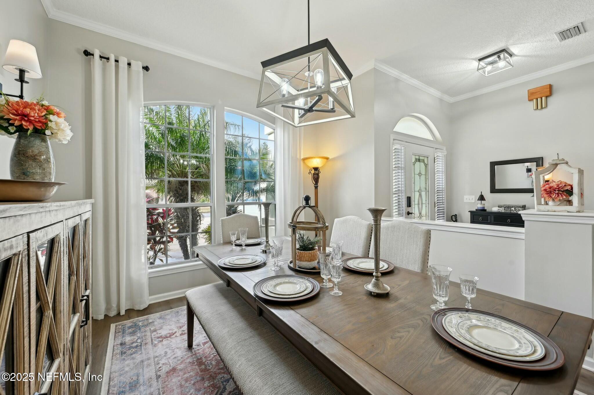1732 Margarets Walk Road Fleming Island, FL 32003 - Photo 8 of 55 a view of a dining room with furniture window and wooden floor