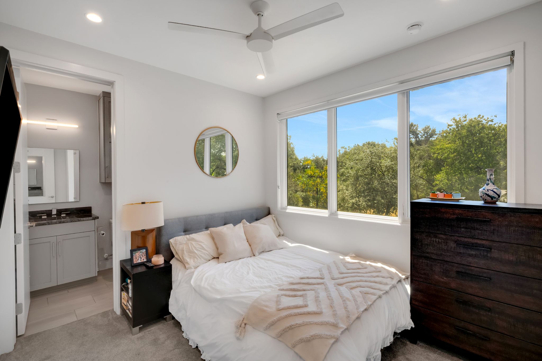 809 Bouldin Avenue Austin, TX 78704 - Photo 35 of 39 Bedroom with light colored carpet, ensuite bath, recessed lighting, and a ceiling fan