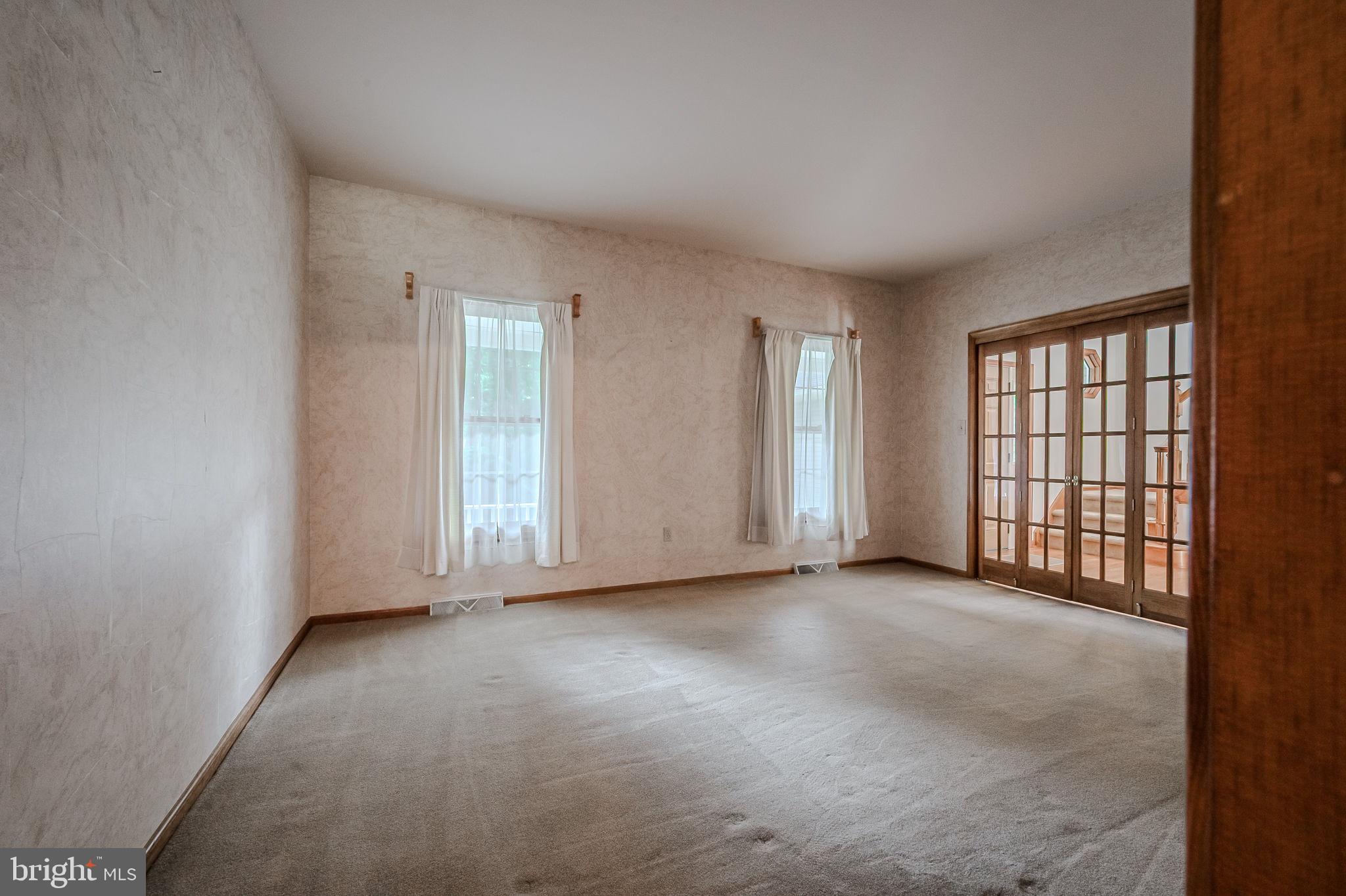 108 Michaels Lane Newark, DE 19713 - Photo 11 of 53 an empty room with windows