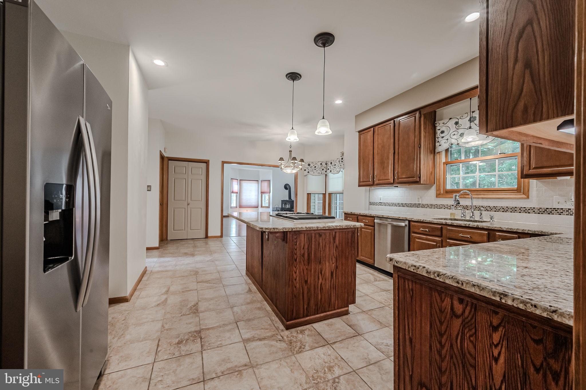 108 Michaels Lane Newark, DE 19713 - Photo 16 of 53 a kitchen with stainless steel appliances granite countertop a stove a sink a refrigerator and a oven