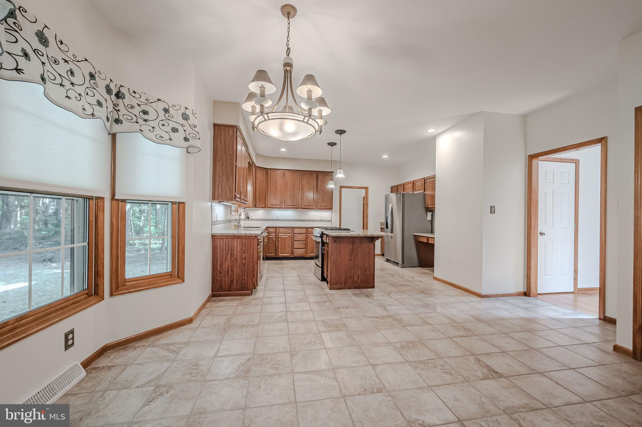 108 Michaels Lane Newark, DE 19713 - Photo 23 of 53 a view of a kitchen with a sink stainless steel appliances cabinets and a kitchen counter top