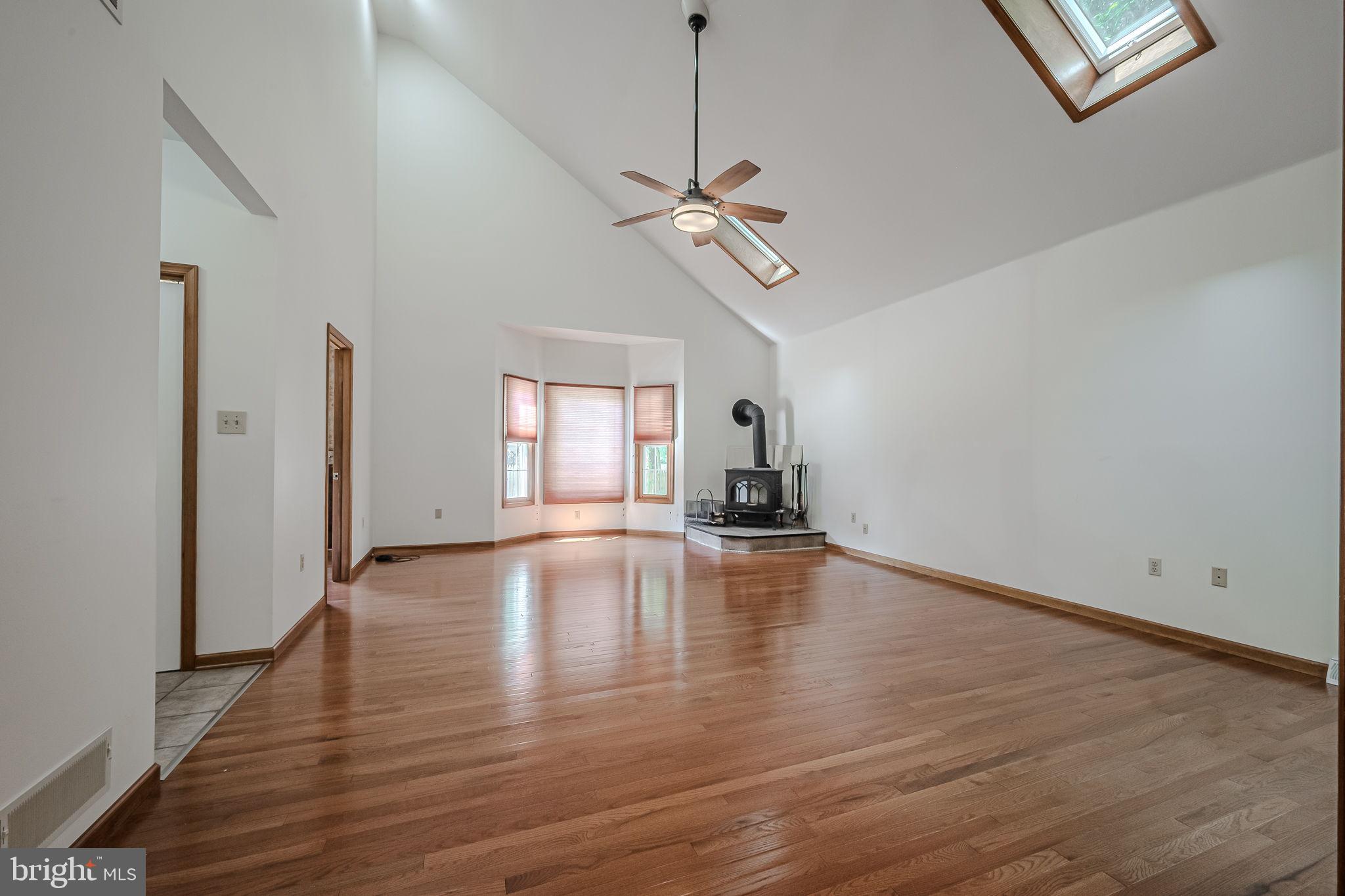 108 Michaels Lane Newark, DE 19713 - Photo 24 of 53 a view of empty room with wooden floor and ceiling fan