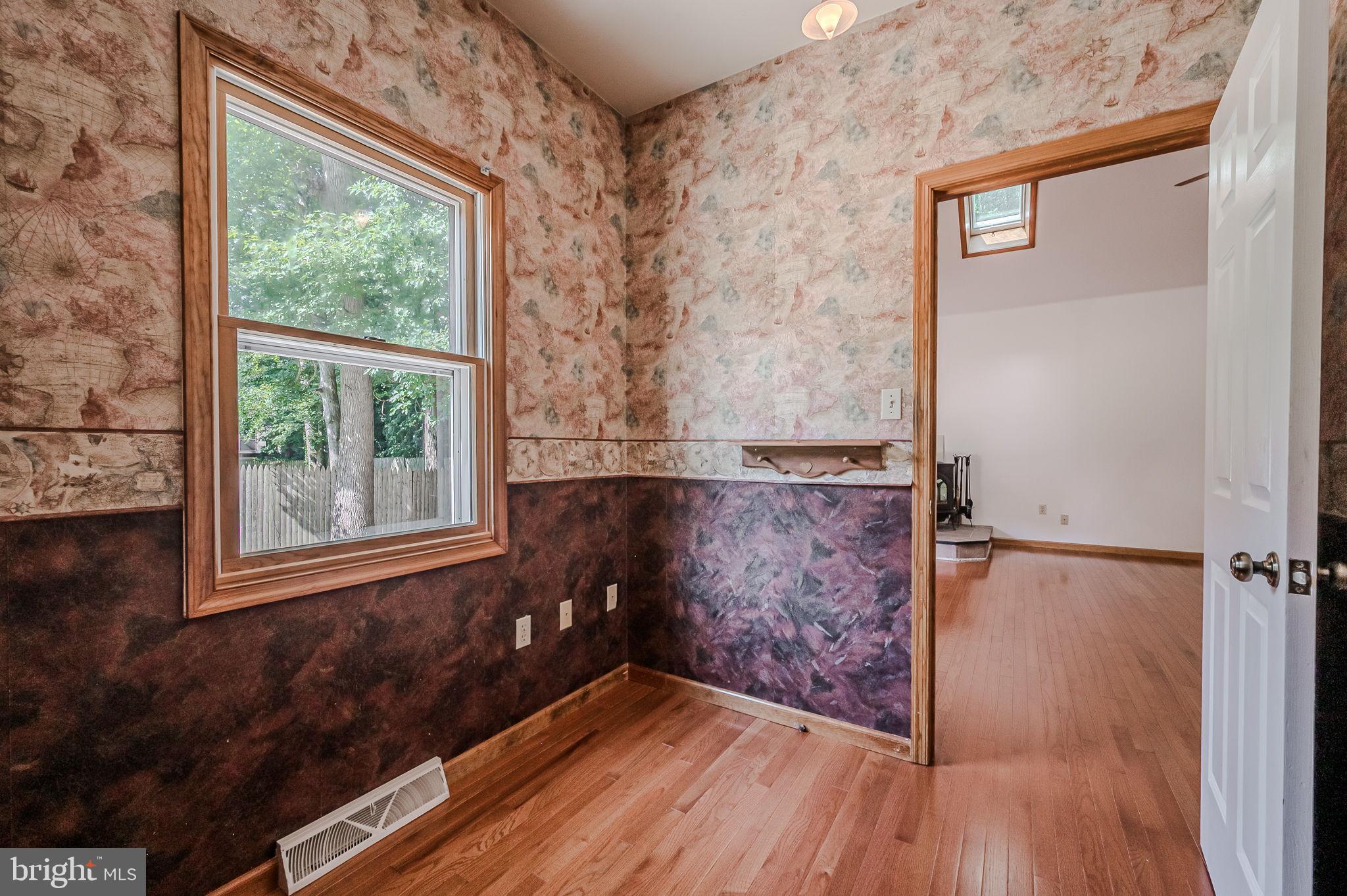 108 Michaels Lane Newark, DE 19713 - Photo 28 of 53 an empty room with a window and wooden floor