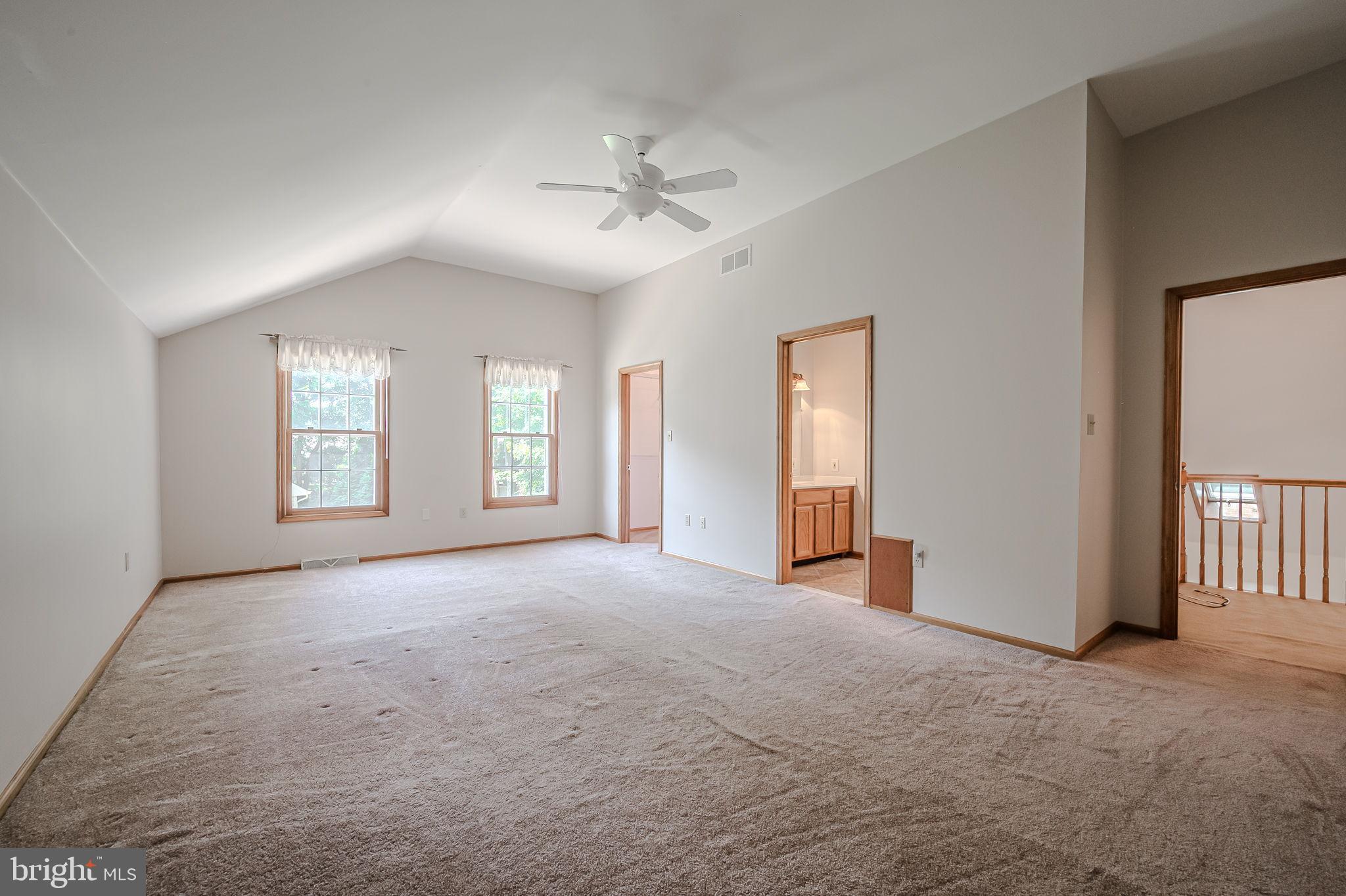 108 Michaels Lane Newark, DE 19713 - Photo 43 of 53 an empty room with windows and ceiling fan