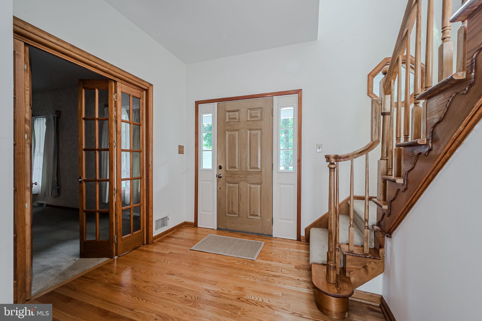 108 Michaels Lane Newark, DE 19713 - Photo 6 of 53 a view of an entryway with wooden floor and door