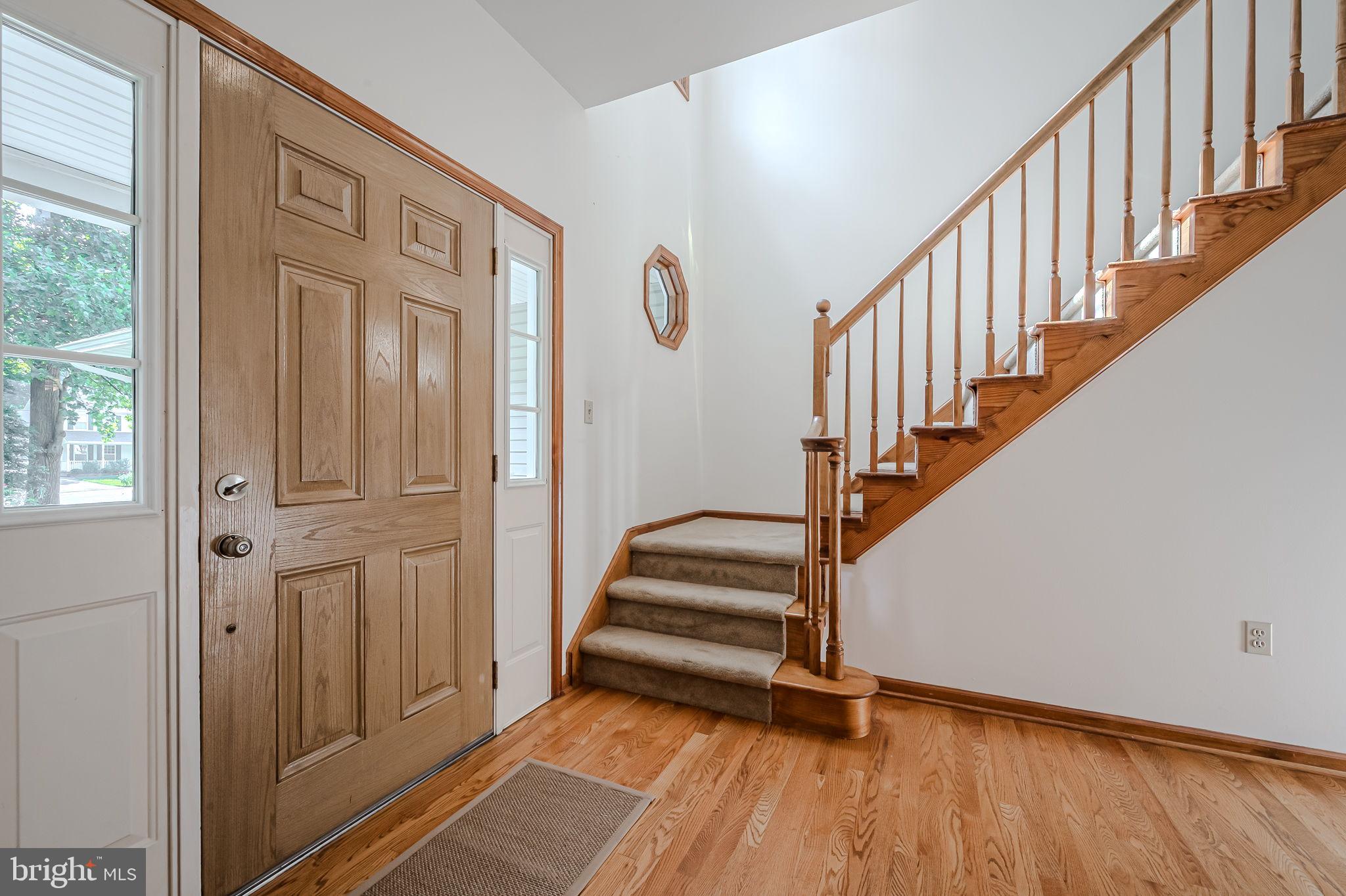 108 Michaels Lane Newark, DE 19713 - Photo 7 of 53 a view of entryway with wooden floor and stairs