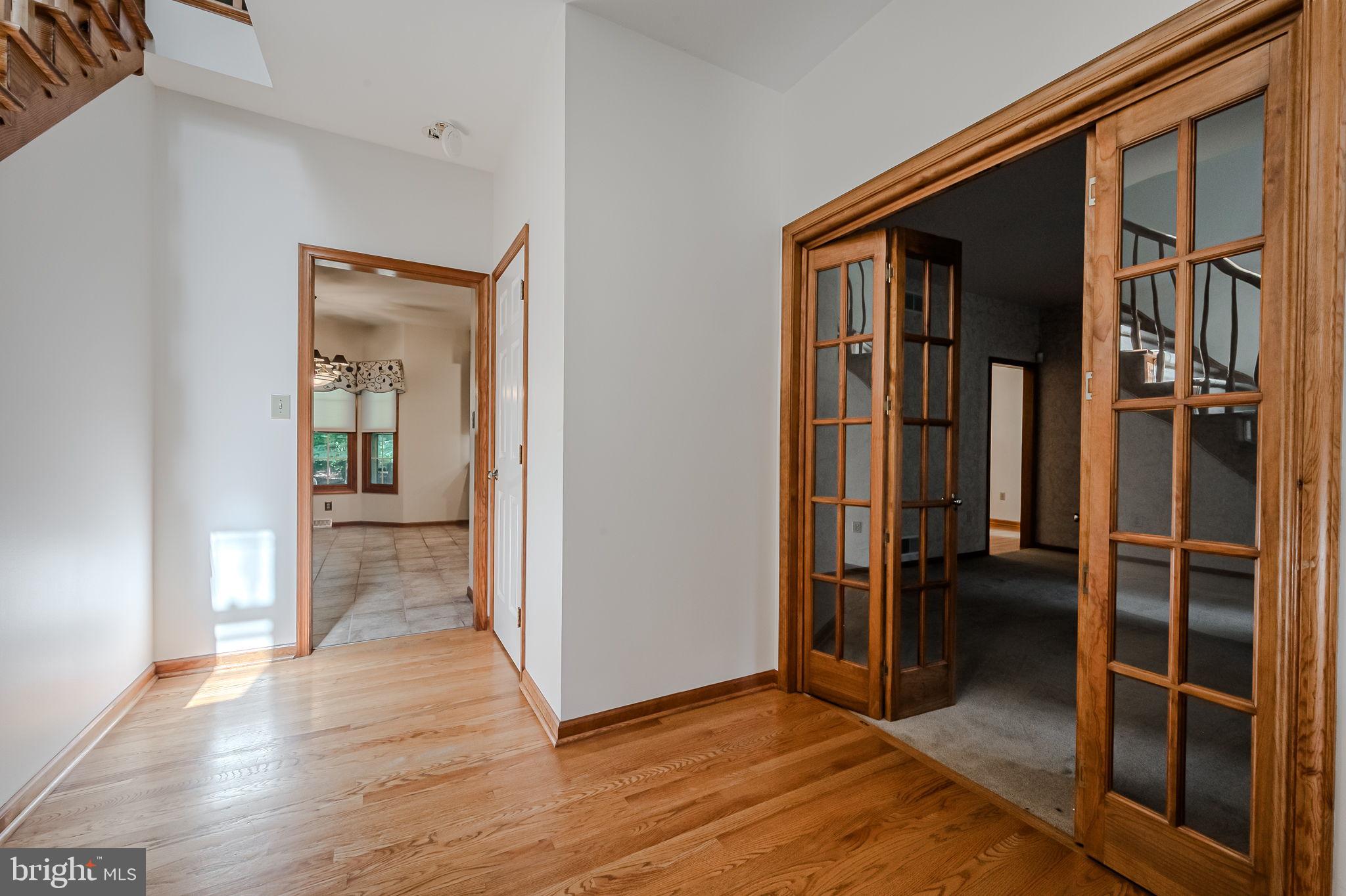 108 Michaels Lane Newark, DE 19713 - Photo 8 of 53 a view of a hallway with wooden floor and closet