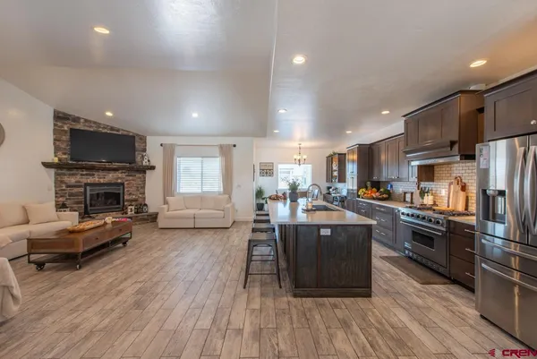a view of a hallway with entryway wooden floor and front door