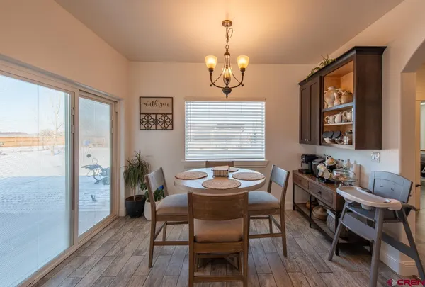 a en suite bathroom with a double vanity sink and a mirror