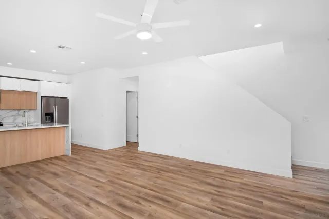 a view of kitchen with wooden floor and window