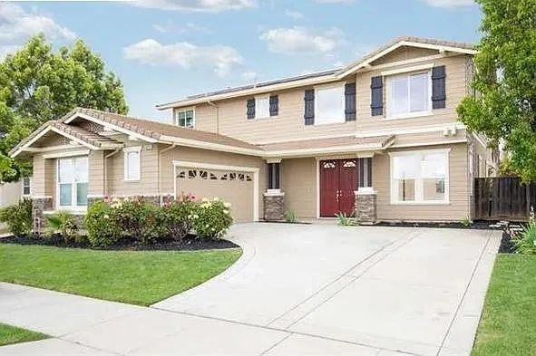 front view of a house with a yard