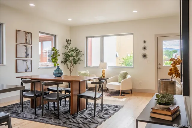 a view of a dining room with furniture window and wooden floor