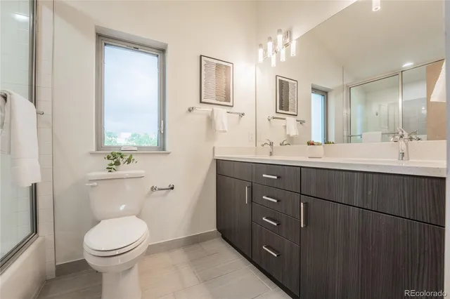 a living room with furniture a couch and a window