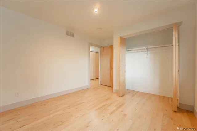 a living room with furniture a large window and a flat screen tv