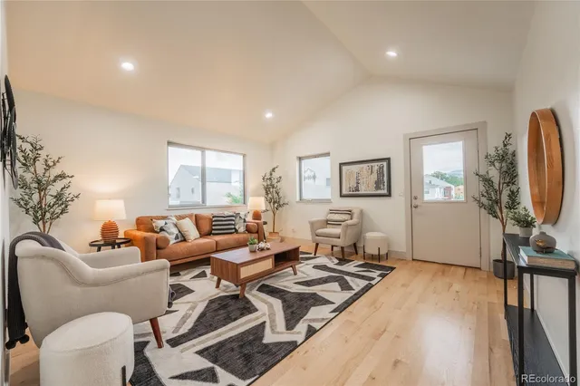 a view of a house with a porch and a yard