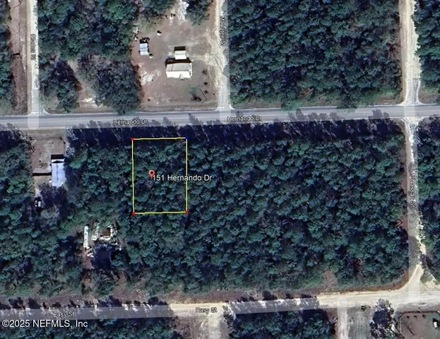 a sign that is sitting in front of flowers