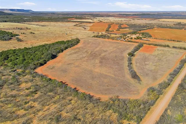 a kitchen with stainless steel appliances granite countertop a refrigerator and a stove