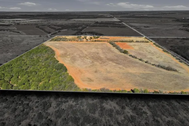 a kitchen with stainless steel appliances granite countertop a table chairs and a refrigerator