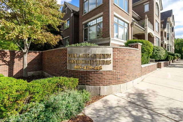 a view of a brick house with many windows