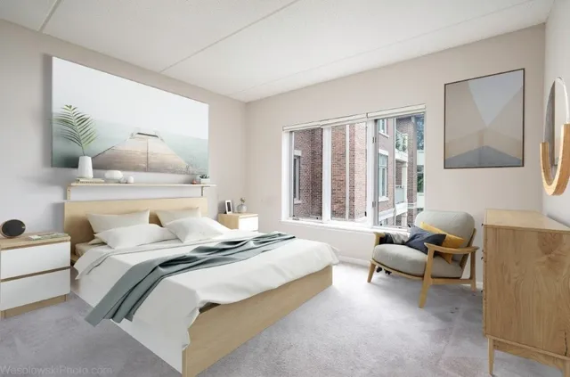 a bedroom with a bed and window