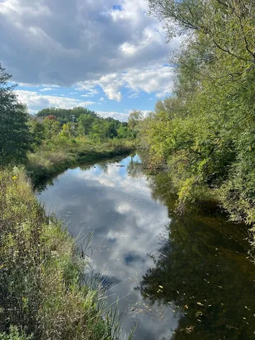 a view of lake with green space