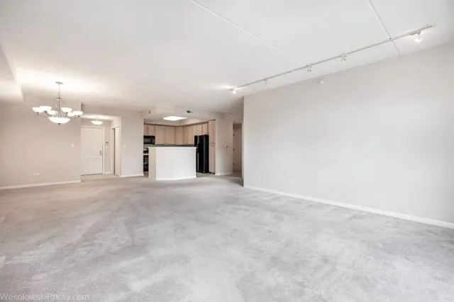 a view of a big room with a fireplace