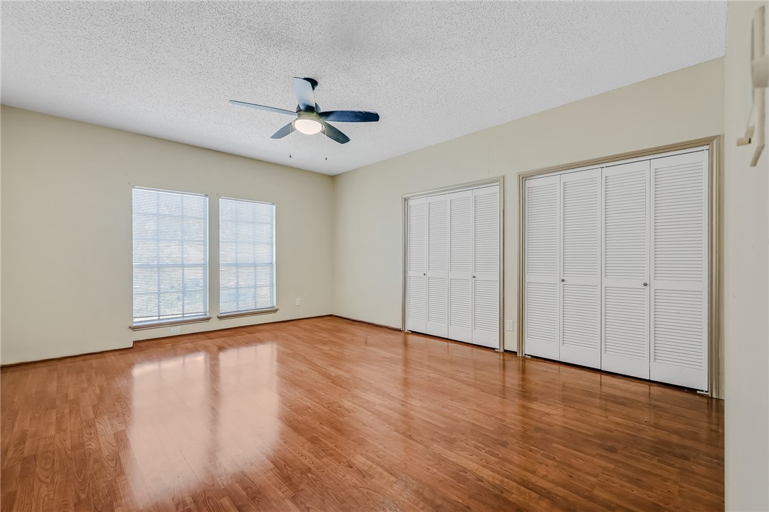 5917 Harvest Hill Road Corpus Christi, TX 78414 - Photo 33 of 40 a view of an empty room with wooden floor and a window