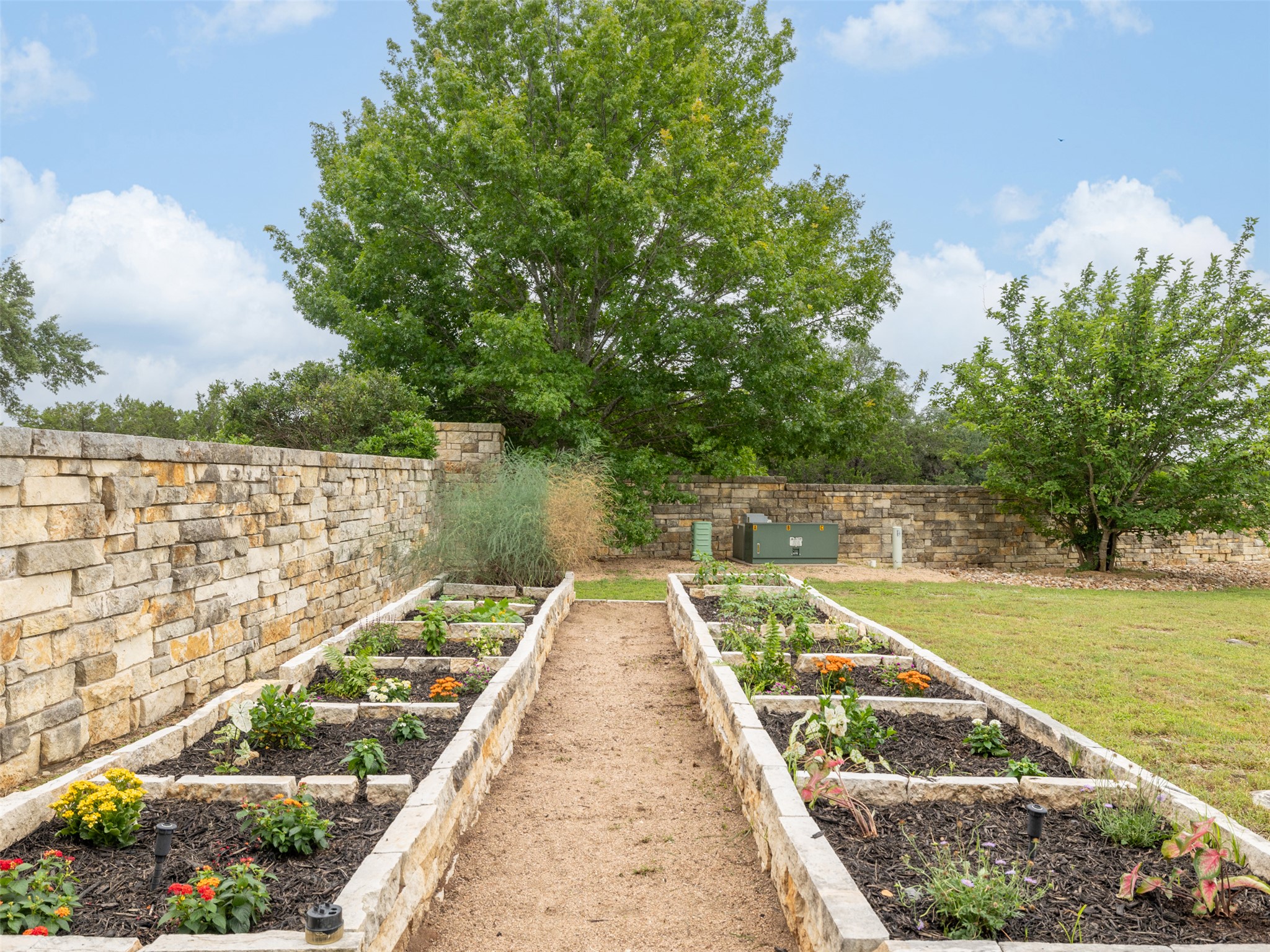 101 Aldea Street Georgetown, TX 78633 - Photo 29 of 40 Custom raised stone garden beds are enjoyment for a cook or gardener to enjoy growing fresh vegetables and herbs!