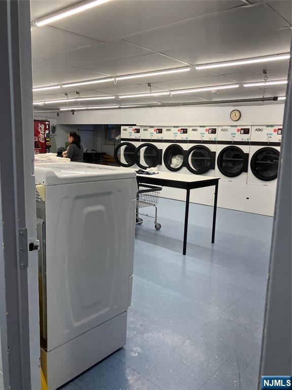 280 Prospect Avenue, Unit 11H Hackensack, NJ 07601 - Photo 17 of 20 a utility room with dryer and washer
