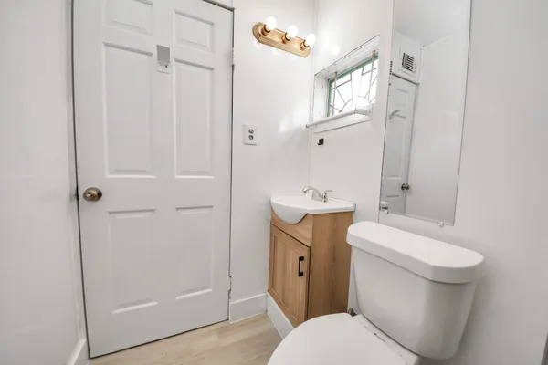 a view of a hallway with wooden shelves