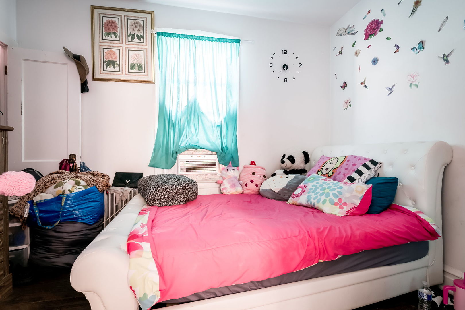 4554 South Washtenaw Avenue Chicago, IL 60632 - Photo 13 of 40 a bedroom with bed and a chandelier