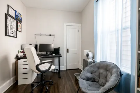 a workspace with furniture and a window