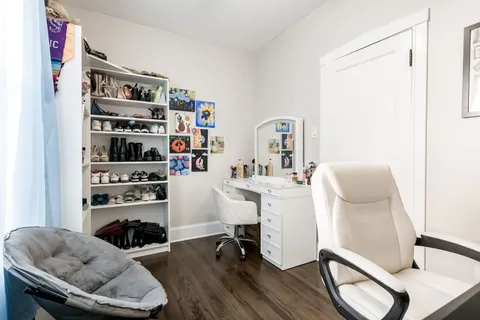 a room with furniture cabinets and window