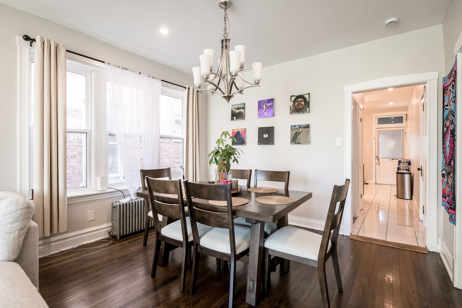 4554 South Washtenaw Avenue Chicago, IL 60632 - Photo 25 of 40 a view of a dining room with furniture window and wooden floor
