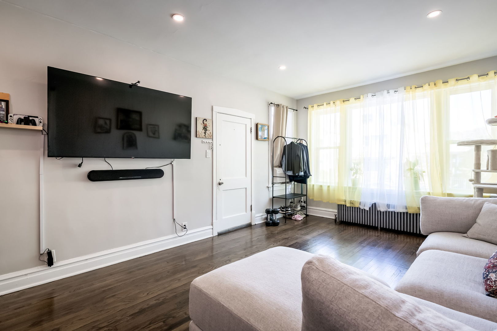 4554 South Washtenaw Avenue Chicago, IL 60632 - Photo 26 of 40 a living room with furniture and a flat screen tv