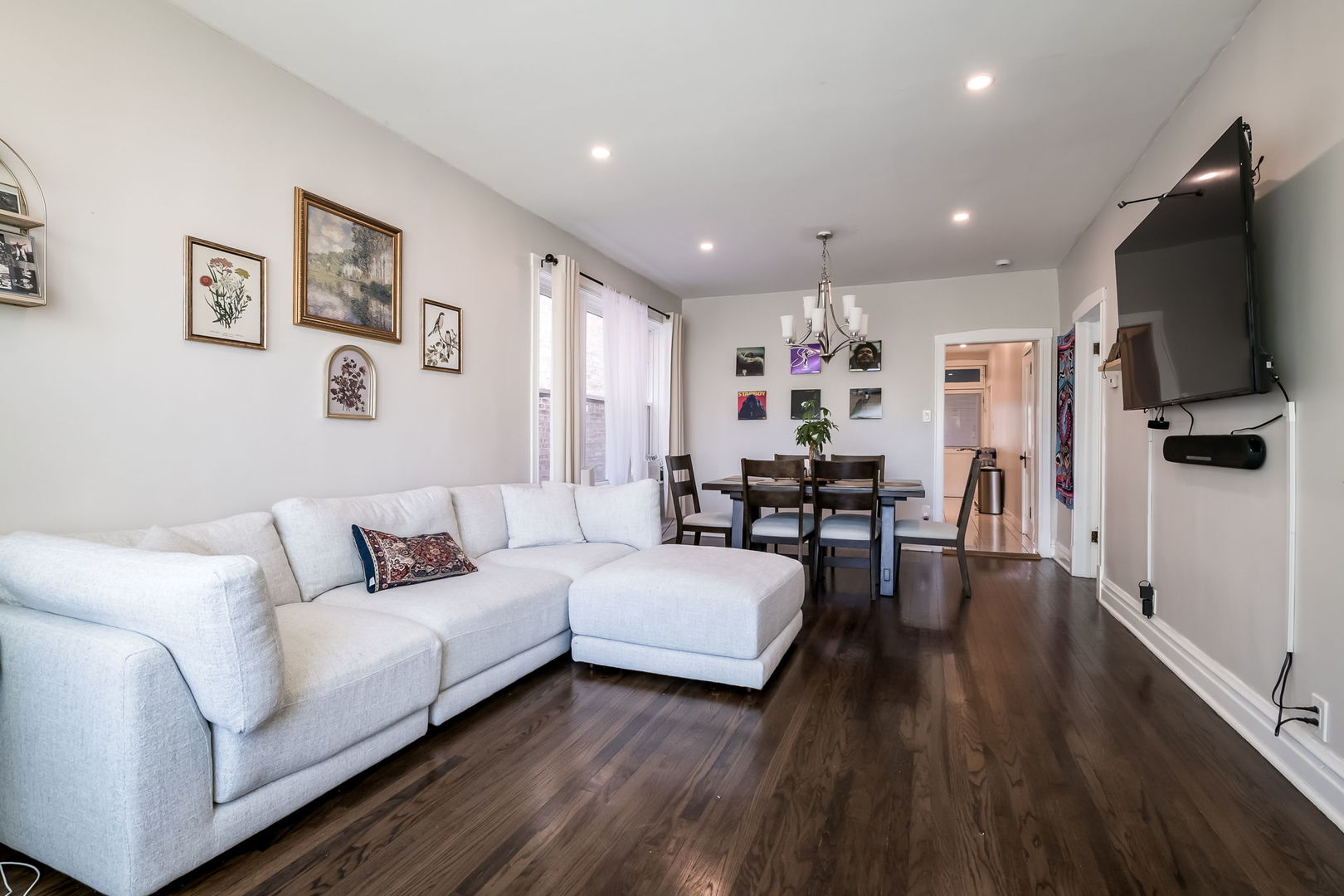 4554 South Washtenaw Avenue Chicago, IL 60632 - Photo 27 of 40 a living room with furniture and a flat screen tv