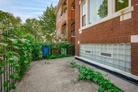 a view of a street with brick building in front of it