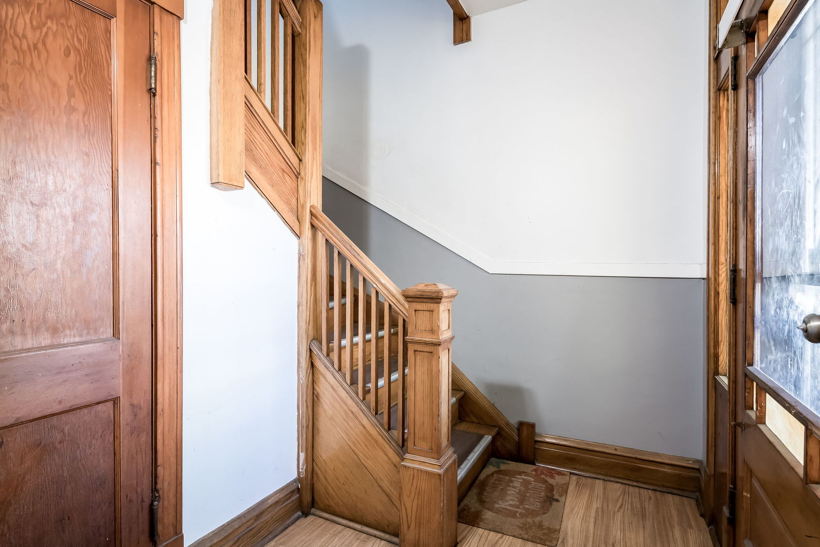 4554 South Washtenaw Avenue Chicago, IL 60632 - Photo 4 of 40 a view of entryway with wooden floor and stairs