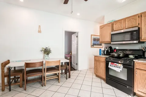 a kitchen with granite countertop a sink and appliances