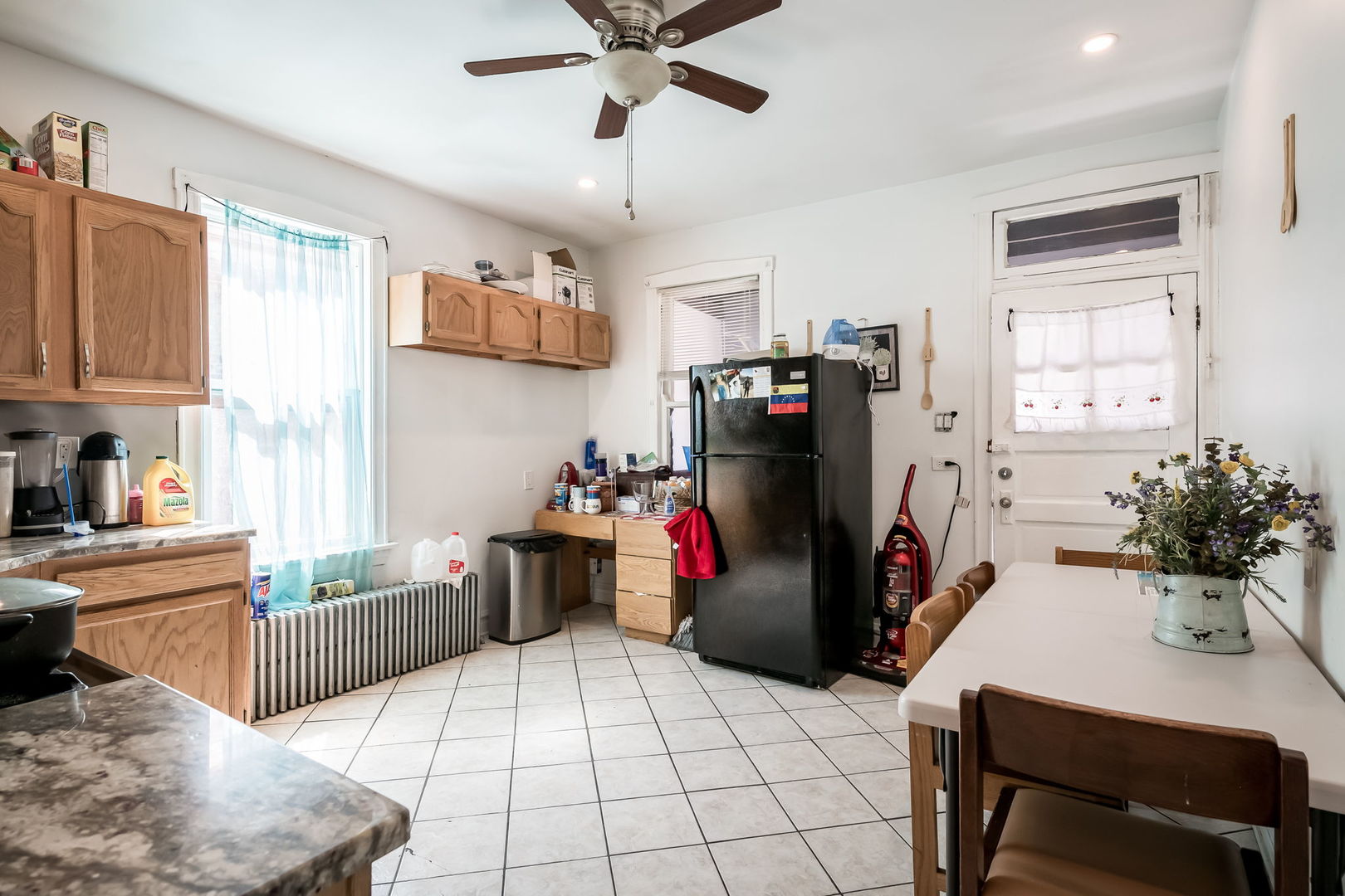 4554 South Washtenaw Avenue Chicago, IL 60632 - Photo 9 of 40 a view of a kitchen with fridge and workspace