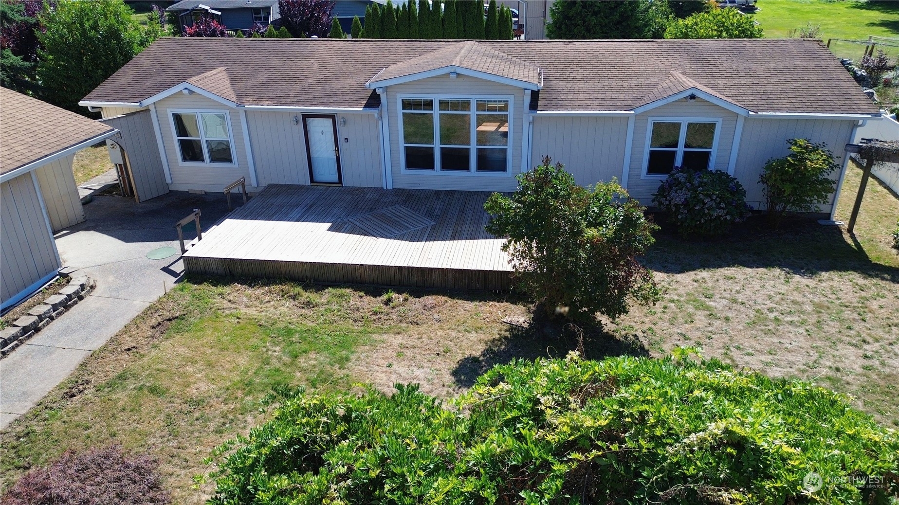 18328 State Rte 20 Burlington, WA 98233 - Photo 3 of 39 a front view of house with yard and trees in the background