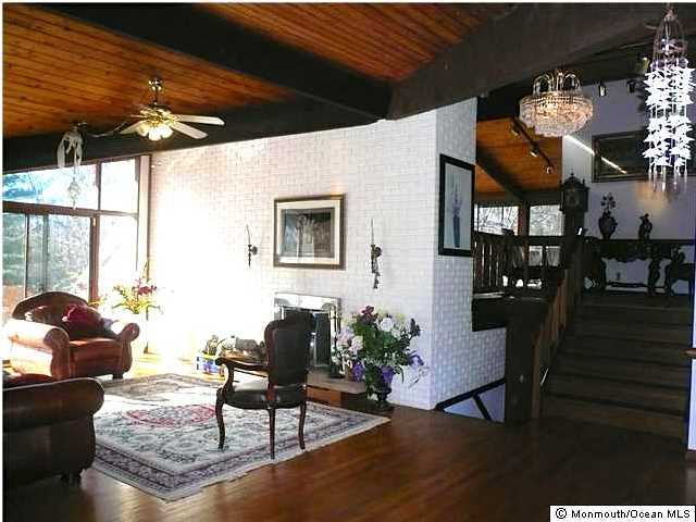 127 Stone Hill Road Colts Neck, NJ 07722 - Photo 6 of 7 a living room with furniture and wooden floor