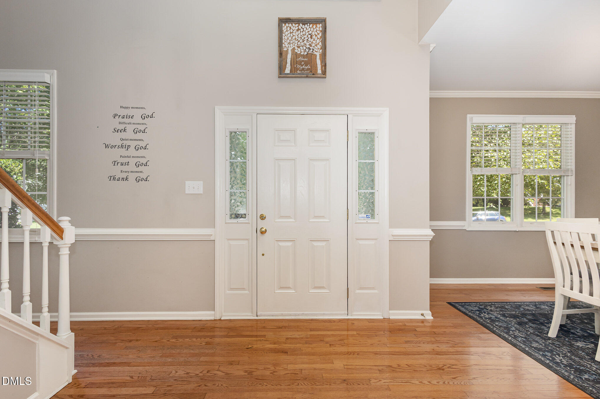 1004 Chancellors Ridge Drive Durham, NC 27713 - Photo 9 of 32 a view of an empty room with wooden floor and windows